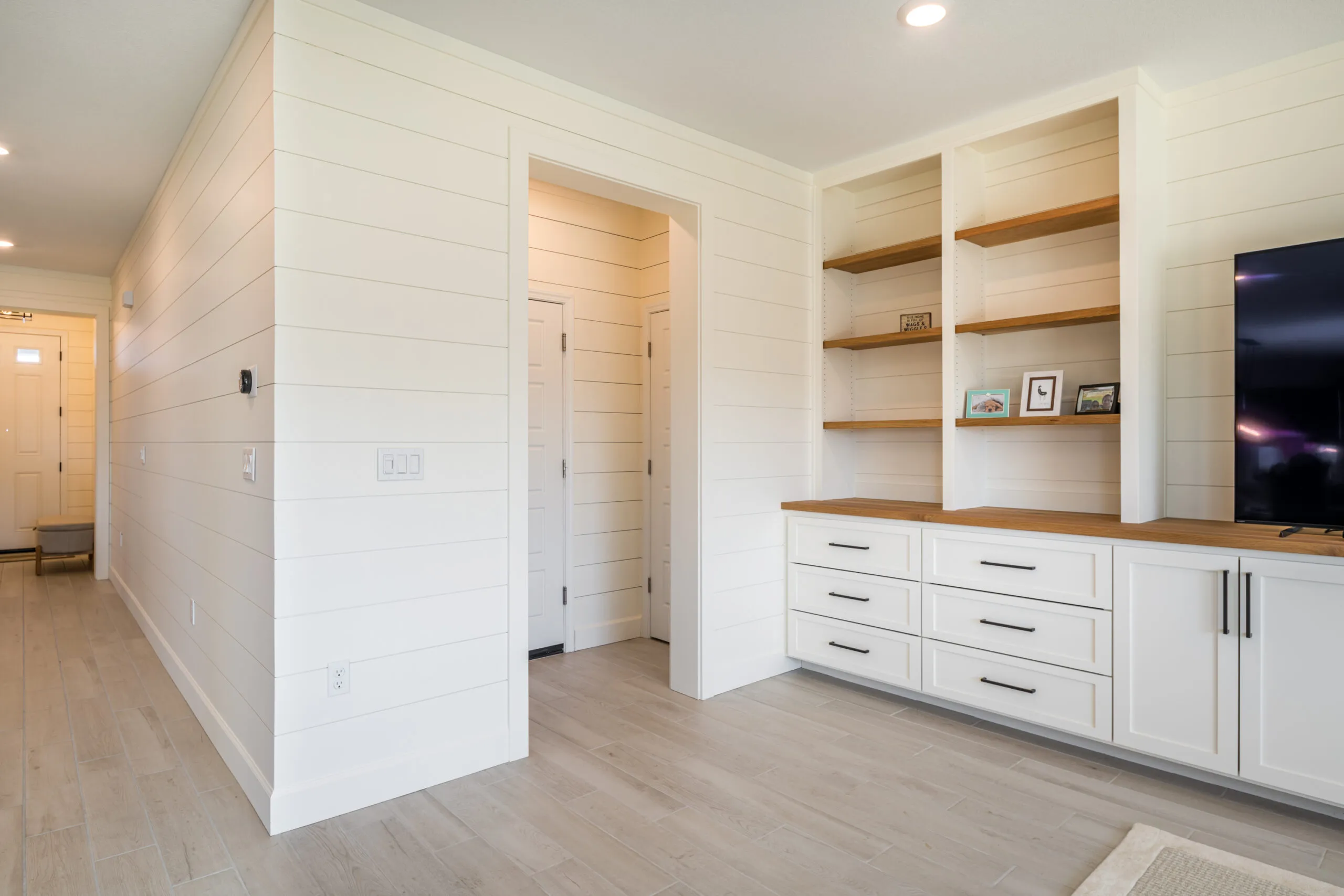 Custom built-in bookcase and entertainment center with adjustable shelving