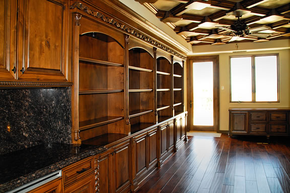 Custom carpentry built-in shelving and cabinetry with detailed trim work