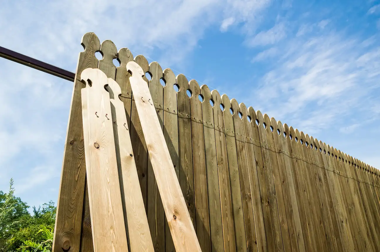 Cedar fence repair and restoration with new pickets and post replacement